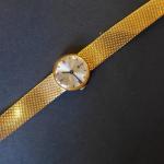 TISSOT : montre bracelet de dame en or 18 K,...