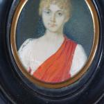 Miniature ovale représentant une jeune femme à la chevelure bouclée...