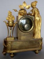 Pendule d'époque début XIX's en bronze doré à décor d'une...
