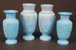 Deux paires de vases en verre opalin bleu moulé, l'une...