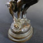DELABRIERE Edouard (1829-1912) : Chien se soulageant. Bronze patiné signé....