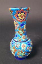 LONGWY : Vase balustre en émaux polychromes à décor floral,...