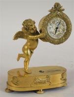 66 - Pendulette d'époque Restauration en bronze doré à décor...