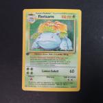 The Pokémon company 
Contenu : Florizarre 
Edition : Base set 1er edition
Langue :...