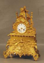 21 - Pendule d'époque Romantique en bronze doré à décor...