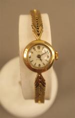 ELOGA - Montre bracelet de dame vers 1960 en or...