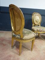 Suite de quatre chaises cabriolets d'époque Louis XVI en bois...