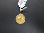 Médaille ronde en or jaune 750 millièmes à décor d'un...