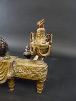 Paire de chenets de style Louis XVI en bronze deux...