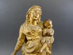 Vierge à l'Enfant foulant le serpent en terre cuite dorée,...