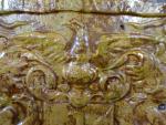 Carreau en terre cuite vernissée à décor en bas-relief aux...