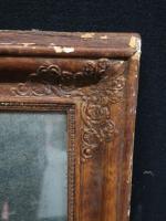 Miroir rectangulaire d'époque XIX' s en bois doré et stuqué....