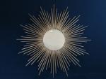 CHATY VALLAURIS - Miroir soleil en métal doré signé au...