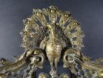Cartel d'applique en bronze à décor de paon, mascaron, fleurs,...