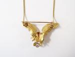Broche-pendentif en or 750 millièmes représentant un aigle tenant un...