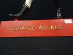 JOHNNIE WALKER - Figurine publicitaire en latex (usures). 
H. :...