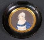 Ecole française du XIX' : Portrait de femme. Miniature ronde....