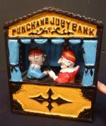 Tirelire mécanique en fonte laquée "PUNCHAND JUBY BANK" représentant un...