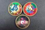The Pokemon compagny 
Ensemble de 3 battle coins 1999 dont...