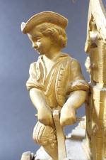 Pendule en bronze doré d'époque Romantique représentant un jeune jardinier...