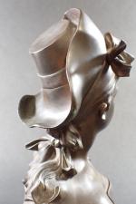 NELSON Alphonse (1854-1919) : Buste d'élégante au chapeau. Bronze patiné...