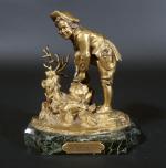 Jeune patineur du XVIII's attachant ses lames. Bronze doré sur...