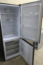 SIGNATURE - Un Refrigérateur congélateur. 190 x 60 x 70...
