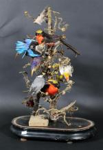 Diorama avec dix oiseaux naturalisés sur un arbre simulé, sous...