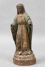 Vierge en bois sculpté en partie polychrome. Travail d'art populaire,...