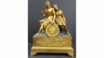 Pendule d'époque Empire en bronze doré et patiné à décor...