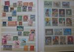 2 classeurs de timbres bien remplis. Ajman  Manama ...