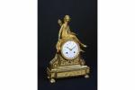 Pendule fin d'époque Louis XVI en bronze doré à décor...