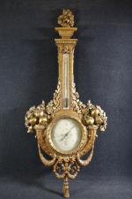 Baromètre de style Louis XVI en bois doré sculpté à...