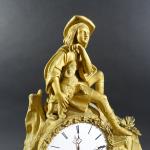 Pendule d'époque Romantique en bronze doré à décor d'un jeune...