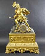 Pendule d'époque Empire en bronze doré et patiné à décor...